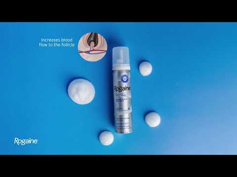 4 dollops of Men's Rogaine Foam Solution and a silver bottle of Foam Solution on a blue background.