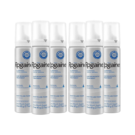 Six silver bottles of Men's Rogaine Foam Solution on a white background.